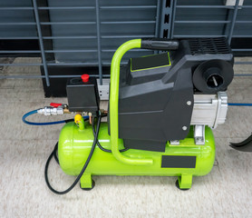 Bright green portable air compressor and accessories