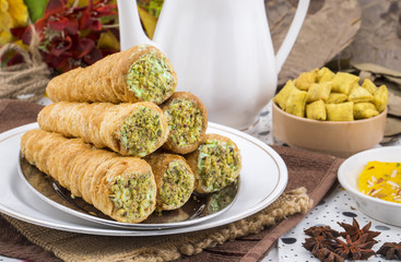 Sweet Bakery Food Puff Roll with Cream Also Know As Homemade Cream Roll, Puff Pastry, Swiss And Jelly Roll is a type of sponge cake roll filled with whipped cream, jam