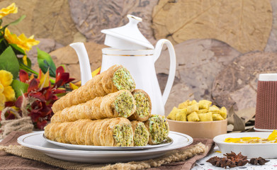 Sweet Bakery Food Puff Roll with Cream Also Know As Homemade Cream Roll, Puff Pastry, Swiss And Jelly Roll is a type of sponge cake roll filled with whipped cream, jam
