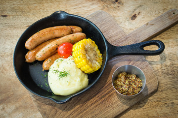 Home cooked gourmet cuisine with rustic wooden background.  Fresh organic ingredients in well balanced meal on white plate.  Copy space for text.