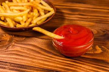 Fresh french fry dipped into the tomato sauce