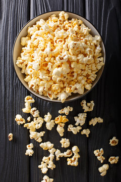 Fototapeta popcorn cheese in a bowl closeup. Vertical top view