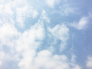 White clouds and blue sky background.