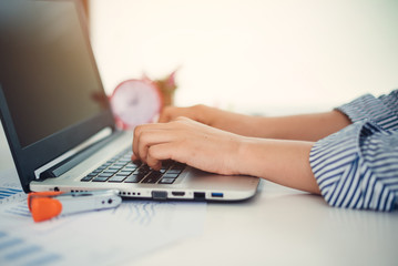 Businesswoman working with laptop.