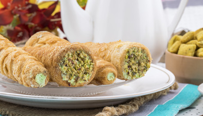 Sweet Bakery Food Puff Roll with Cream Also Know As Homemade Cream Roll, Puff Pastry, Swiss And Jelly Roll is a type of sponge cake roll filled with whipped cream, jam