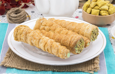 Sweet Bakery Food Puff Roll with Cream Also Know As Homemade Cream Roll, Puff Pastry, Swiss And Jelly Roll is a type of sponge cake roll filled with whipped cream, jam