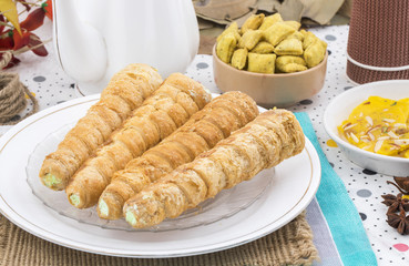 Sweet Bakery Food Puff Roll with Cream Also Know As Homemade Cream Roll, Puff Pastry, Swiss And Jelly Roll is a type of sponge cake roll filled with whipped cream, jam