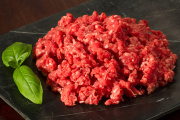 Fresh Ground Beef with Garnish on Slate Close Up