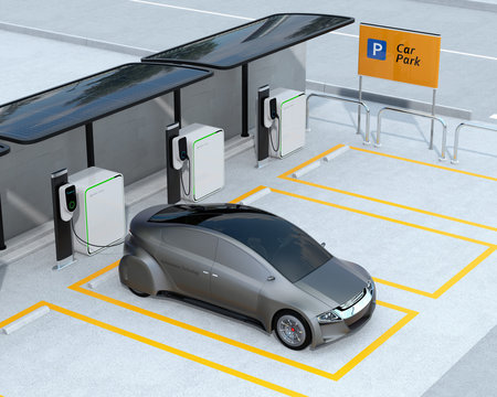 Metallic gray autonomous car recharging in parking lot. Electric car charging service concept. 3D rendering image.