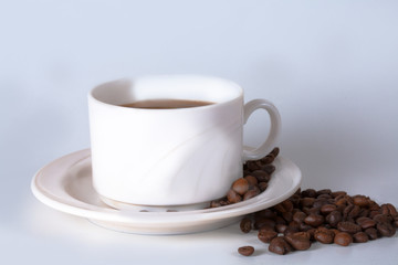 Coffee cup and beans on old kitchen table. Top view with copyspa