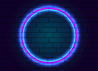 Neon frame is round on brick wall background.