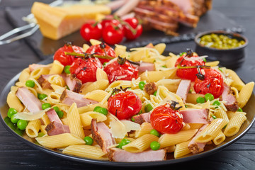 salad with pasta penne, ham, peas