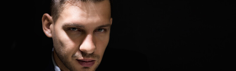 Fototapeta premium Tricky sly man face in dark room