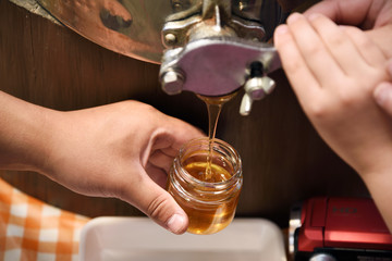 bottling the harvested honey