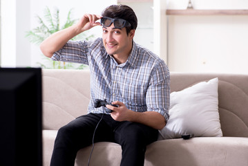 Man playing 3d games at home