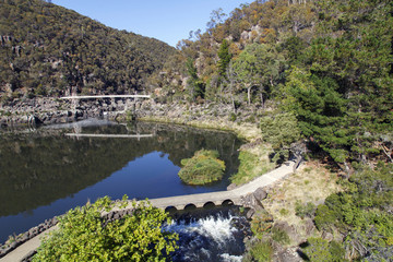 Fototapeta na wymiar The first basin at Cataract Gorge with Alexandria footbridge over South Esk River in Launceston, Tasmania. A beautiful and relaxing area for families and tourists to explore.