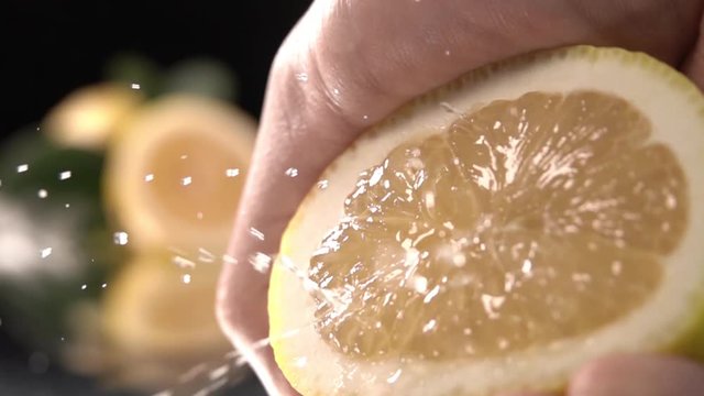 Squeezing lemon, slow motion