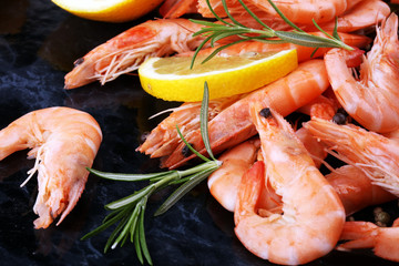 Raw fresh Prawns Langostino Austral. shrimp seafood with lemon and spices.