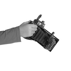 Naklejka premium Photocamera in hands by close-up on the white isolated background.