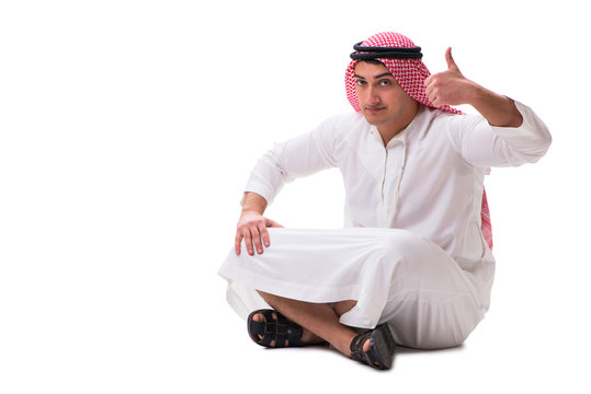 Young arab man sitting isolated on white