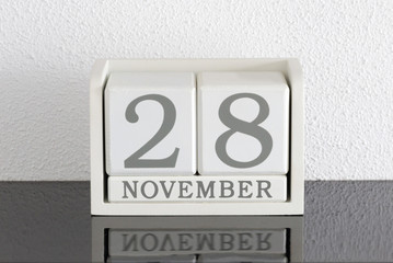 White block calendar present date 28 and month November