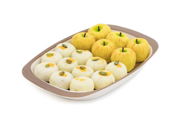 Indian Mix Sweet Food Apple Shaped Peda With White Peda Also Know as pedha, pera or peday is a prepared in thick, semi-soft pieces. the main ingredients are khoya, sugar and flavorings