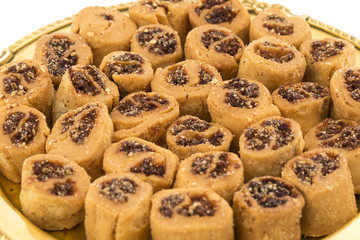 Indian Fried Bhakarwadi Tea Time Snack also known as bakarwadi, bakarvadi, bakar vadi, bakar wadi or spring roll is a traditional spicy Maharashtra and Gujarat Snack isolated on White Background