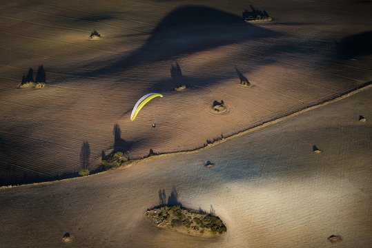 Paragliding over fields, near Algodonales, Andalusia, Spain, Europe