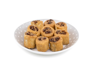 Indian Fried Bhakarwadi Tea Time Snack also known as bakarwadi, bakarvadi, bakar vadi, bakar wadi or spring roll is a traditional spicy Maharashtra and Gujarat Snack isolated on White Background
