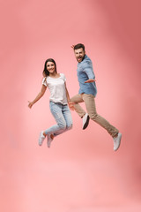 Full length portrait of a cheerful young couple