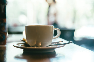 Cup of coffee on the table in the cafe