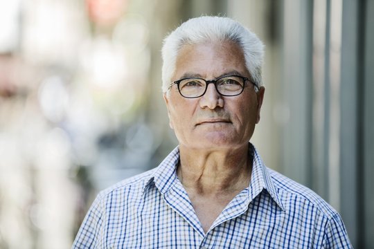 Grey-haired Senior with glasses, migration background, native Italian, portrait, Germany, Europe