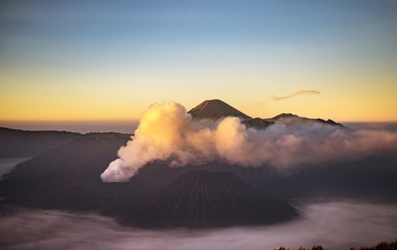 View of volcanoes at sunrise, smoking volcano Gunung Bromo, Batok, Kursi, Gunung Semeru, Bromo-Tengger-Semeru National Park, Java, Indonesia, Asia