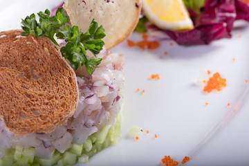 Рыбное блюдо с зеленью и лемоном. Fish dish with greens and a lemon
