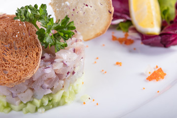 Рыбное блюдо с зеленью и лемоном. Fish dish with greens and a lemon

