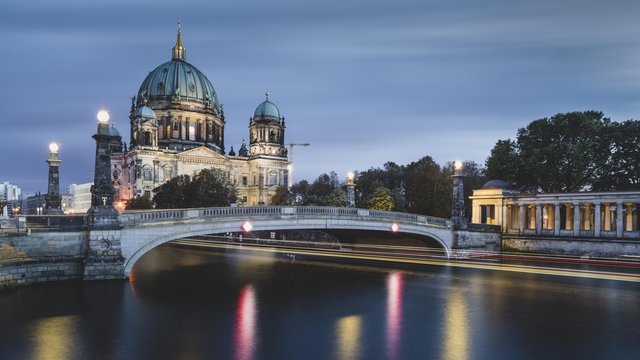 Berlin Cathedral on the Spree River with passing excursion steamer, light traces, dusk, Berlin, Germany, Europe