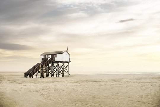 Pile dwelling on the beach of Sankt Peter-Ording, Bohler Strand, Sankt Peter-Ording, North Frisia, Schleswig-Holstein, Germany, Europe