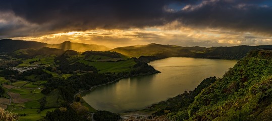 Furnassee with hilly landscape and dramatic atmospheric lighting, dark clouds, Furnas, Sao Miguel, Azores, Portugal, Europe