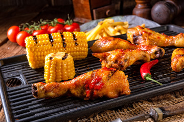 Rustic Grilled chicken wings,legs,and spicy corn