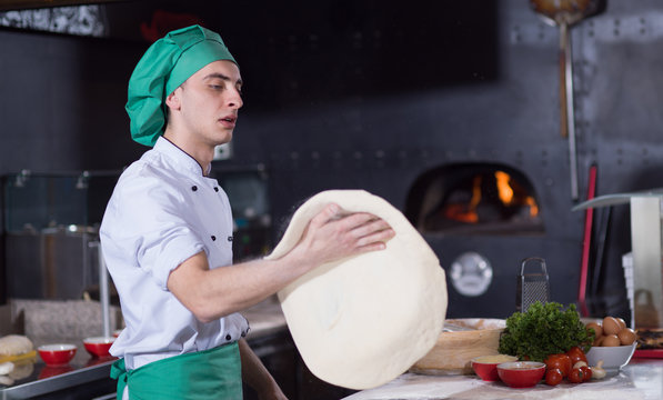 Chef Throwing Up Pizza Dough