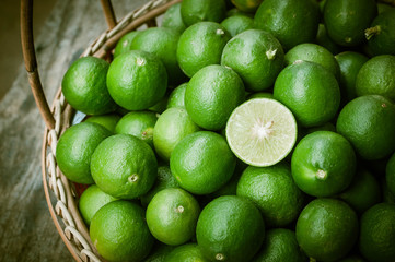 Green lemon in rattan basket