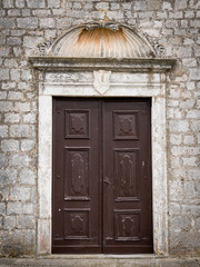 Closed door of a christian monastery in Croatia