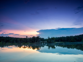 Obraz na płótnie Canvas twilight at the lake with two tone sky