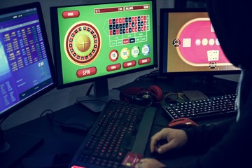 Playing gambling online on computer laptop - obrazy, fototapety, plakaty