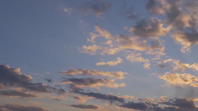 

Moving clouds on sky at sunset. Nature background.