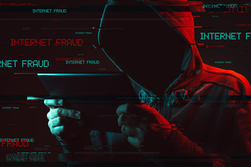 Internet fraud concept with faceless hooded male person © Bits and Splits