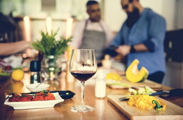 Group of friends are cooking in the kitchen