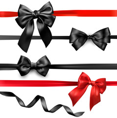 Black and red satin bows isolated on white.