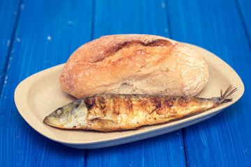 grilled sardine with bread on dish