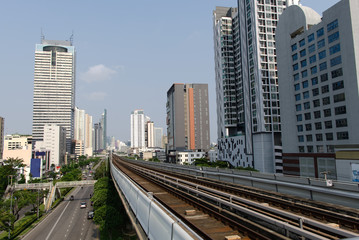 Fototapeta na wymiar The railway of skytrain leading through the center of the city and surrounded by tall buildings.